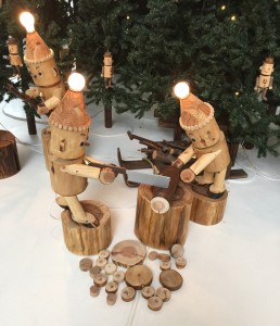 wooden dolls cutting trees